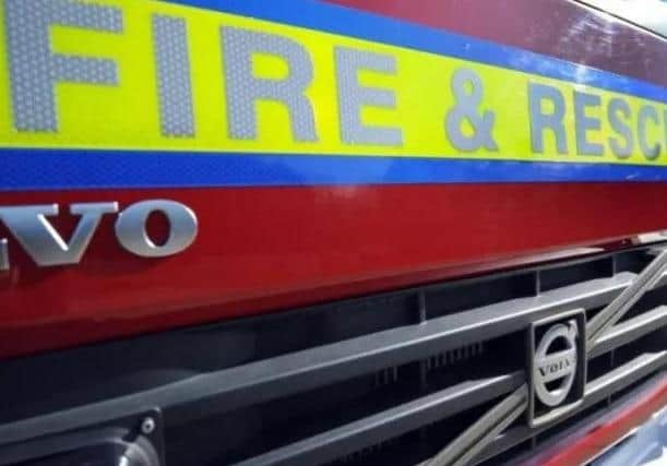 Two people have been taken to hospital after a flat fire in Warwick tonight (Wednesday).