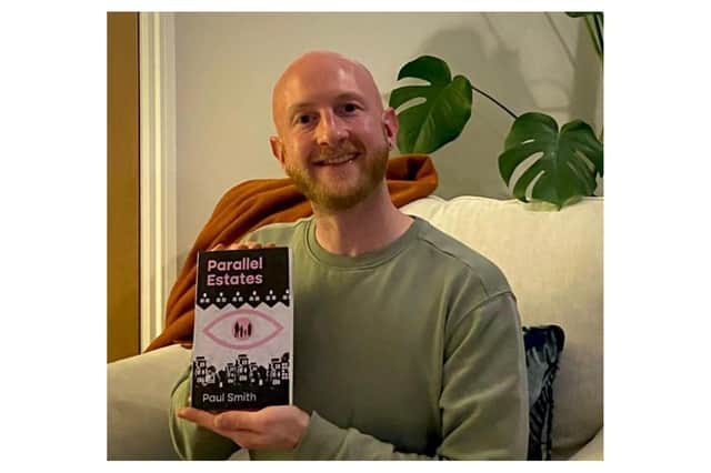 Greg Smith with the book Parallel Estates. Photo supplied