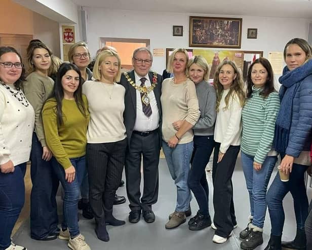 Leamington Mayor Cllr Alan Boad with women from the Polish community in Leamington at the commemorative event. Picture supplied.