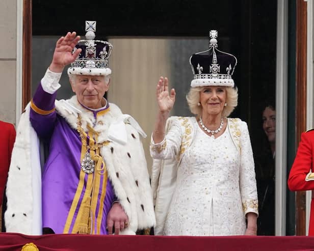 King Charles III and Queen Camilla on the balcony of Buckingham Palace following the coronation on May 6, 2023. Picture: Owen Humphreys/PA Wire.