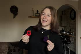 Lowri with her handmade poppies.