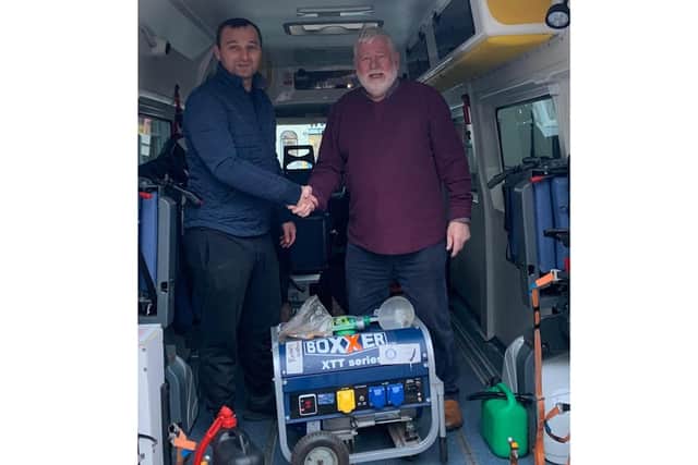 Dick Dixon of Warwick Folk Festival was able to donate a generator which will go directly to an orphanage which recently lost all power. Pictures shows Dawid Kozlowski from Leamington Polish Centre and Dick Dixon. Photo supplied