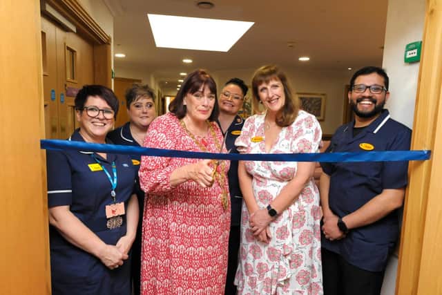 The Mayor of Rugby, Maggie O'Rourke officially opens the home’s new nursing community with General Manager, Michelle Sides.