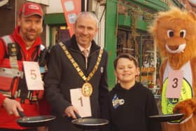 Rugby Mayor Simon Ward with friends trying out frying pans for size