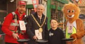 Rugby Mayor Simon Ward with friends trying out frying pans for size