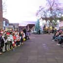 All Saints Choir and Community Band in market square.