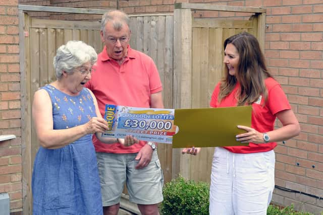 Sarah Vincett and Christopher Vincett with lottery ambassador Judie McCourt. Photo supplied by The Postcode Lottery