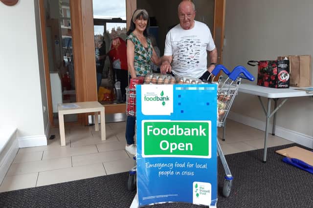 David Proffitt-White delivers another trolley full of eggs and other food to the Warwick District Foodbank drop-off at  St Paul's church with his friend Marion Colman. Photo by Oliver Williams.