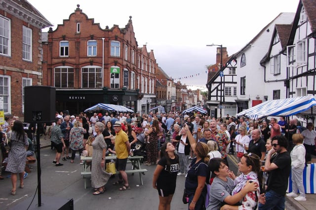 The event saw many shops, restaurants and businesses coming onto the street to join the celebrations. Photo by by Geoff Ousbey