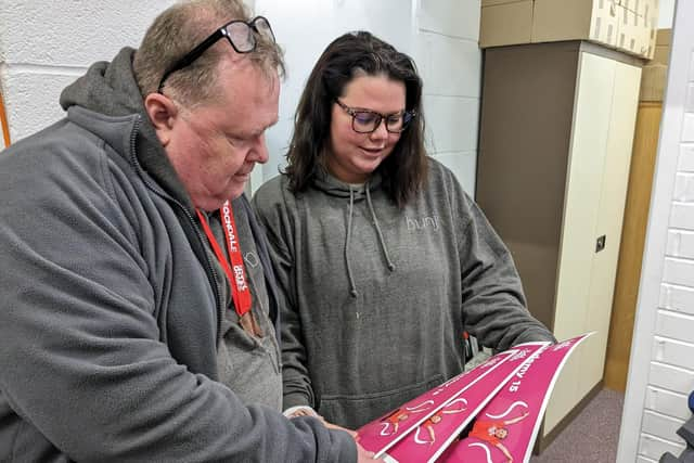 Steve Boyle signs off an order for Leah Weston. Photo supplied