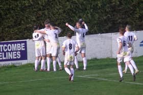 Racing celebrate Cal Templeton's opener v Wulfrunians.