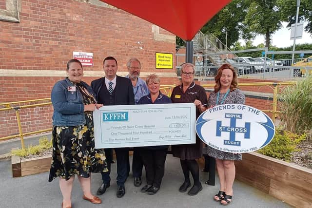 Heroes Ball organisers Jo Wood and Gary Atkins presented a cheque to representatives of The Friends and the staff at the Hospital of St Cross.