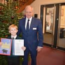 left to right Crackley Hall School Junior 3 pupil Chace Ward with his Christmas card design and Headmaster Rob Duigan. Picture supplied.