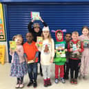 Lighthorne Heath Primary School pupils celebrate receiving a donation of books for their school library from Taylor Wimpey on World Book Day. Picture supplied.