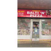 The smashed window on the front door of Sydenham Balti 'N' Pizza. Picture supplied.