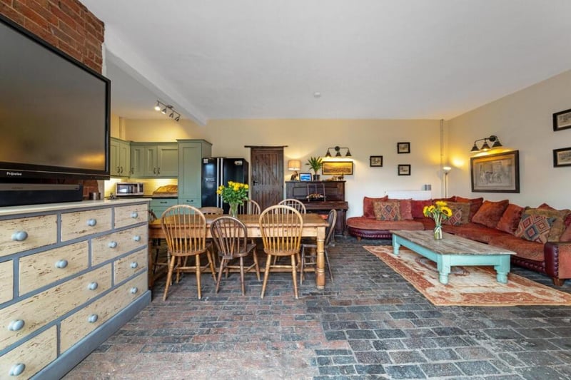 The open plan kitchen/living room/dining room.