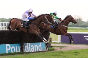 Boombawn (left) jumps the last fence alongside Way Out (centre) and Call Of The Wild