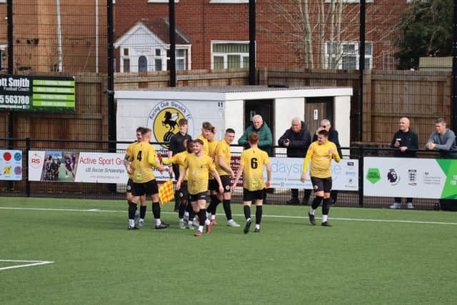 Warwick celebrate Callum Rudd's opener.