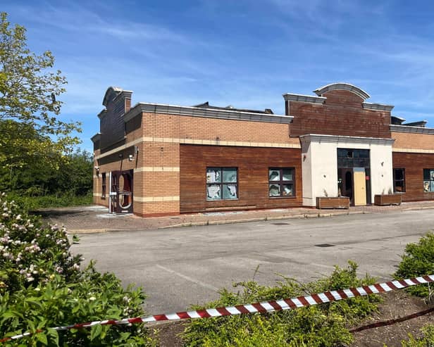 The unit as it appeared the morning after the fire - with portions of the roof collapsed.