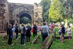 A guided tour at the Abbey ruins in Abbey Fields in Kenilworth