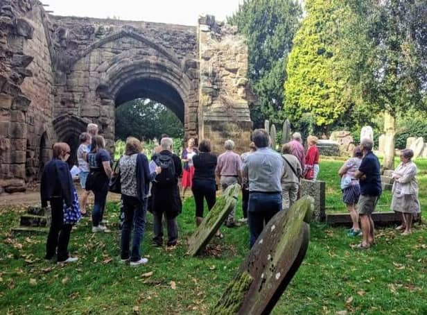 A guided tour at the Abbey ruins in Abbey Fields in Kenilworth