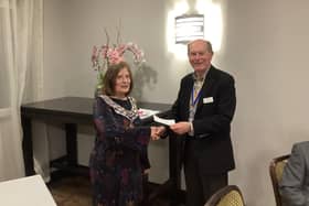 The Mayor of Kenilworth, Cllr Alix Dearing, receives a donation to her charities from David Morgan, the president of the Rotary Club of Kenilworth.