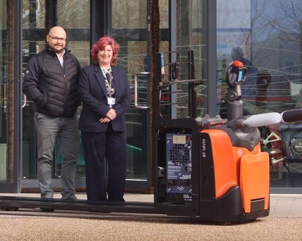 Emerging Technology Delivery Manager Craig Line and MTI Operations Director Lisa Bingley with the Toyota Levio LPE 220 powered pallet truck