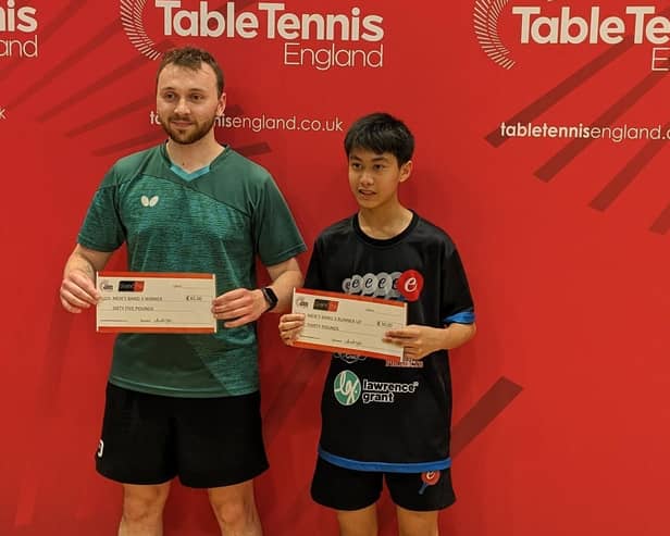Lee Dorning collects his cheque alongside runner-up Janak Shah.