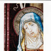 The embroidery of the Weeping Madonna was done for a church in Rugby in the late 19th century.
