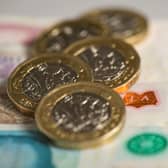 File photo dated 26/01/18 of pound coins and English bank notes, as households with children and pets are feeling particularly tightly squeezed by rising living costs, research suggests.