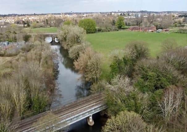 This picture shows the railway bridge in the foreground looking upstream to canal bridge with the farm to the right and substation to the left.