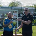 Jim Scott, chairman at Leamington FC, hands over the trophy