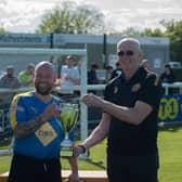 Jim Scott, chairman at Leamington FC, hands over the trophy