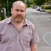 Warwickshire county councilor Will Roberts (Green Leamington Willes) shows one of the covered up 20mph speed markings in and around Gainsborough Drive in Sydenham. Picture supplied.