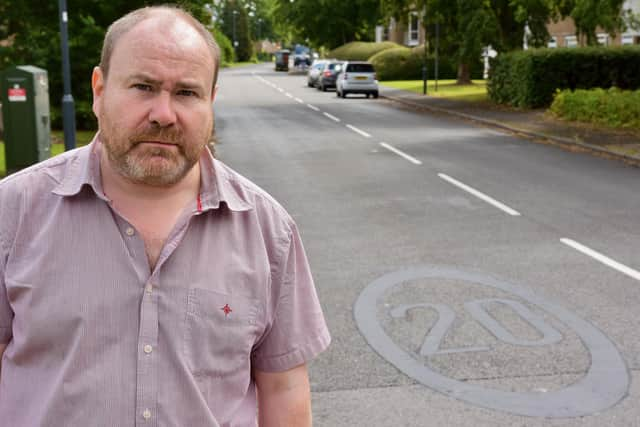 Warwickshire county councilor Will Roberts (Green Leamington Willes) shows one of the covered up 20mph speed markings in and around Gainsborough Drive in Sydenham. Picture supplied.