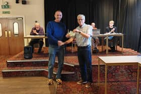 Jeff Reading from Cancer Research accepts the cheque from Ian Sewell.