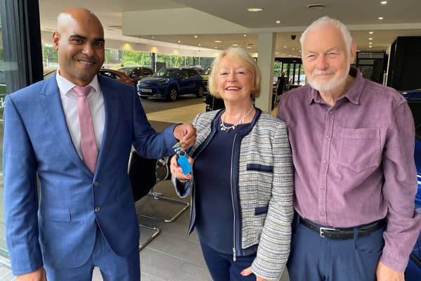 Kia Startin business manager Anwar Hussain presents the keys to Mary Wilde and her husband Michael at the Startin Kia - Warwick dealership. Picture supplied.