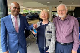 Kia Startin business manager Anwar Hussain presents the keys to Mary Wilde and her husband Michael at the Startin Kia - Warwick dealership. Picture supplied.