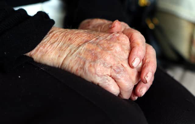 EMBARGOED TO 0001 THURSDAY NOVEMBER 3 File photo dated 7/10/2013 of the hands of an elderly woman at home, as a significant proportion of elderly people plan to cut back on the amount of money they spend on care amid the cost-of-living crisis, a new poll suggests.
