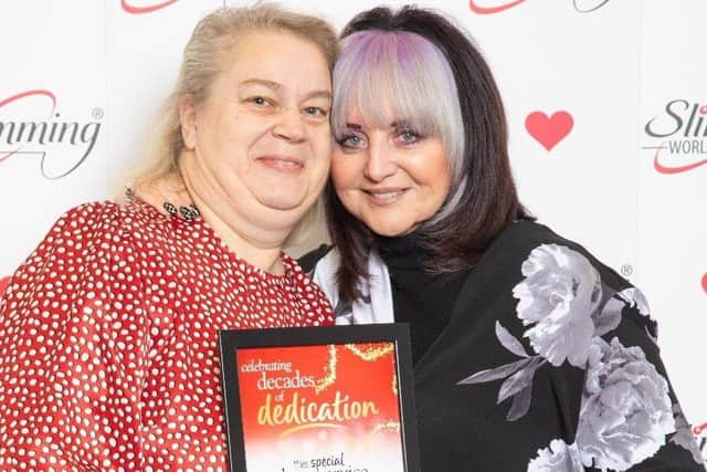 Suzanne receiving her award from Slimming World founder Margaret Miles-Bramwell