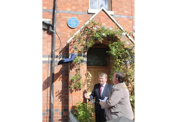 Leamington Mayor Cllr Nick Wilkins and Johnathan Heynes unveil the blue plaque in honour of William Heynes at 11 Percy Terrace in Leamington.