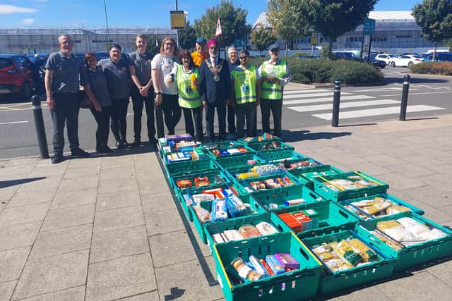Morrisons staff, volunteers, members of the Warwick Lions Club and the Mayor of Warwick, Cllr Parminder Singh Birdi with some of the donations from the rally. Photo supplied