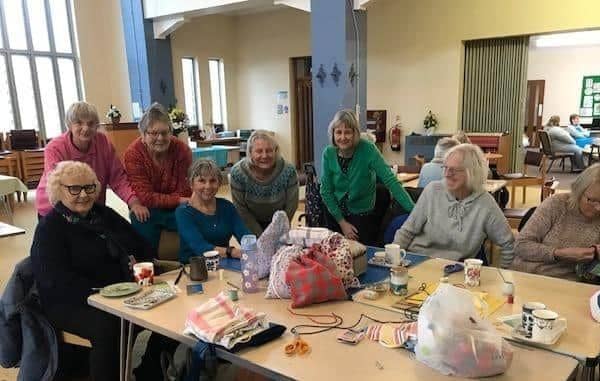 Club volunteers at Rugby Methodist Church Centre doing their bit for Extra Mile’s school in Sierra Leone.