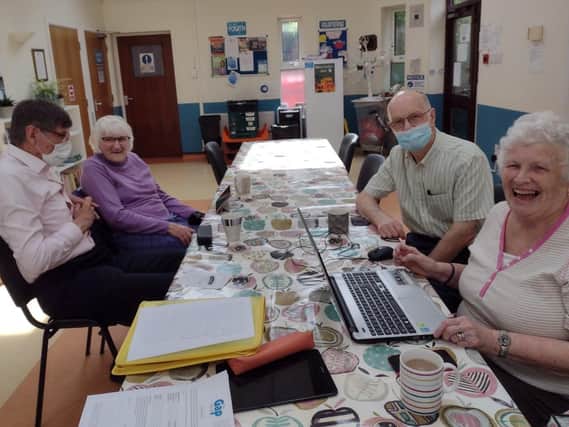 Computer Café volunteers help Warwick older adults with IT difficulties. Photo supplied
