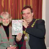 Leamington History Group Secretary, Margaret Rushton presents a copy of Global Leamington to Leamington Mayor, Nick Wilkins. Photo by Allan Jennings.