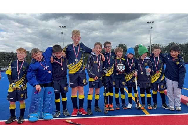 Rugby's Under 10s boys with their medals, celebrating becoming Midlands Champions