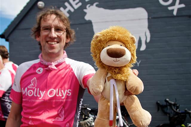 Alastair Frew from Lodders solicitors with an Olly the Brave toy. Photo by Dave Fawbert