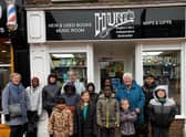 All smiles outside Hunt's bookshop.