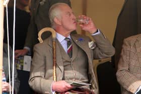 King Charles III enjoys a dram during the Mey Highland Games at the John O'Groats Showground in Caithness. Photo by Robert MacDonald/PA Wire