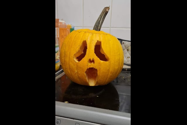 Beckie and Adam shared a photo of their Scream-inspired pumpkin